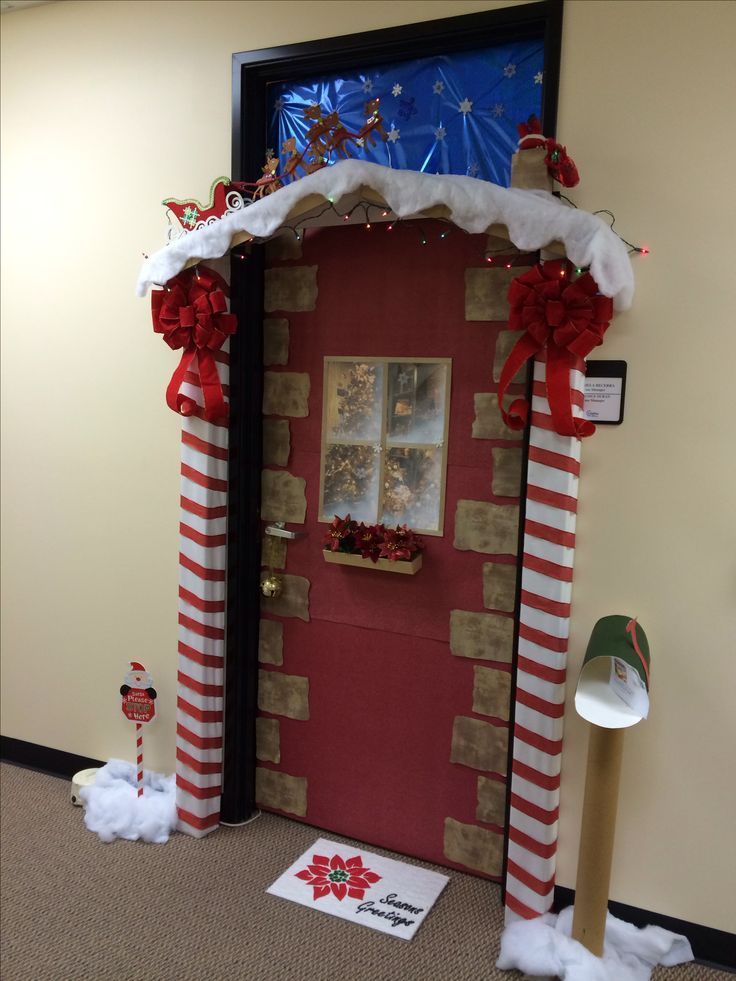 a door decorated for christmas with decorations