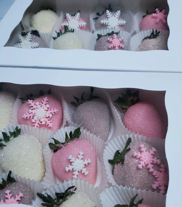 a box filled with chocolate covered strawberries next to another box full of strawberrys