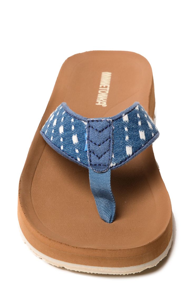 A cushioned footbed and thick rubber sole lend comfortable support to a stylish flip-flop secured with a center toe post. Cushioned footbed Textile upper and lining/rubber sole Imported Adjustable Textile Sandals With Cushioned Footbed, Casual Canvas Sandals With Cushioned Footbed, Casual Denim Sandals With Removable Insole, Casual Canvas Sandals With Rubber Sole, Denim Blue Round Toe Sandals For Beach, Denim Blue Sandals For The Beach, Adjustable Blue Flip Flops With Textured Footbed, Casual Flip Flops With Branded Insole And Toe Post, Comfortable Adjustable Flip Flops With Rubber Sole