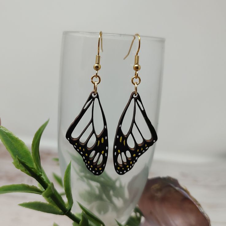 Fly into style with these Monarch Butterfly Wing Wooden Earrings! Lightweight and eye-catching with yellow and white spots, these earrings are built for the butterfly lover in you! They flutter and flaunt with every head turn, so you'll be sure to turn heads - no cocoon required ;) Length: 2.5 Inches Weight: 1 oz Material: Wood Earring Finding Type - French Hook Style Silver or Gold Hooks Nickel-free Super lightweight Hand-Painted Earrings Include Rubber Backing Butterfly Wing Earrings Diy, Wing Earrings Diy, Gold Hooks, Wood Earring, Butterfly Wing Earrings, Hand Painted Earrings, Painted Earrings, Butterfly Wing, Wing Earrings