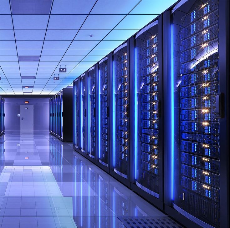 rows of servers in a data center with blue lights on the ceiling and tiled floor