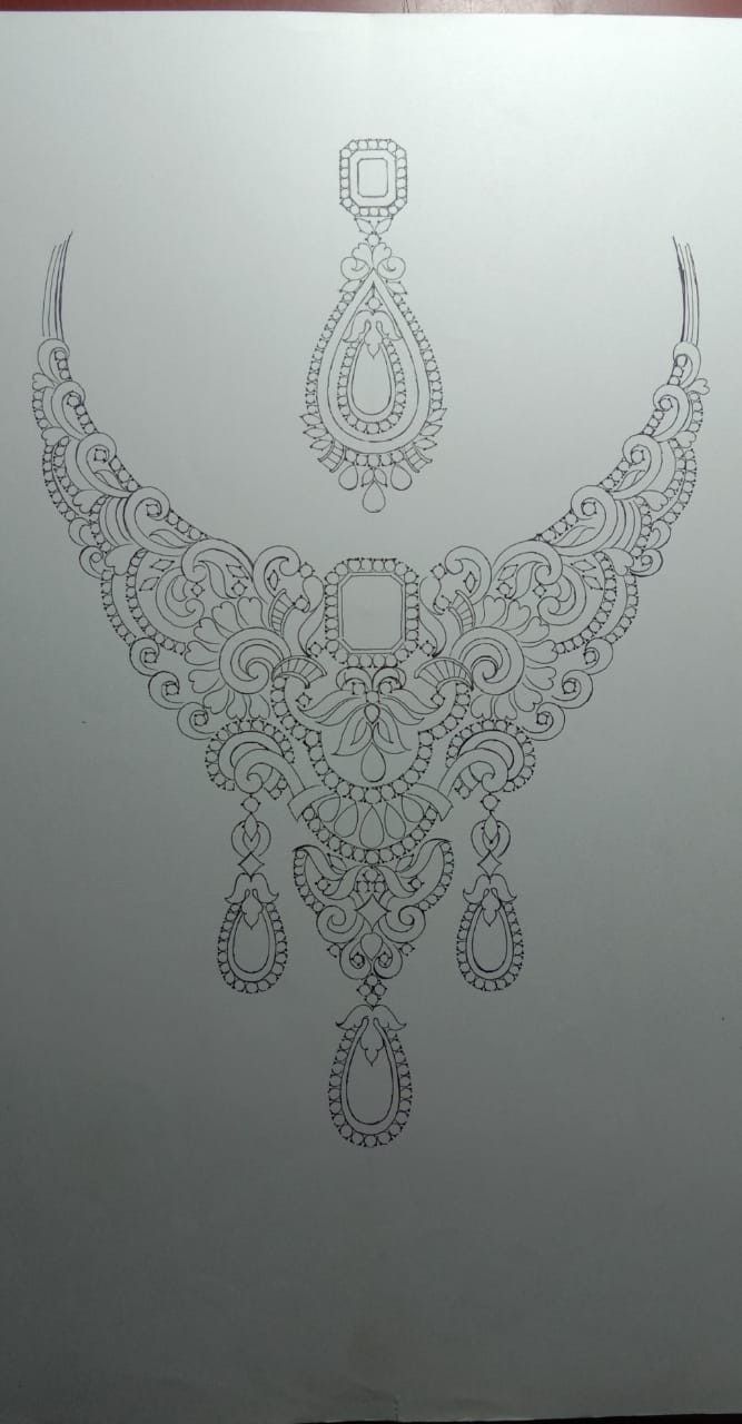 a drawing of an ornate necklace on white paper