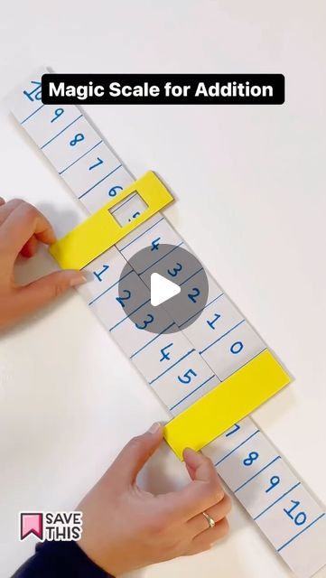 someone is using a ruler to make a game for kids with letters and numbers on it