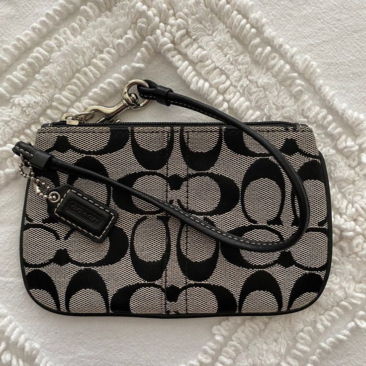 Corner Zip Wristlet In Coach's Signature Black Canvas Never Used - No Signs Of Wear Nor Stain Packaged In A Smoke Free Home Coach Black Wristlet For Evening, Coach Black Evening Wristlet, Black Coach Wristlet For Evening, Black Clutch With Silver-tone Hardware For Everyday Use, Black Wristlet For Evening, Coach Black Wristlet With Zipper Pouch, Chic Black Coach Wristlet, Silver Wristlet For Evening, Chic Black Wristlet With Zipper Pouch