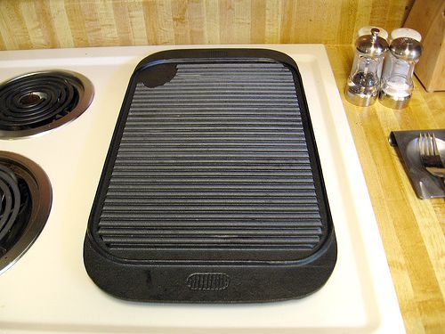 a stove top with a griddle on it