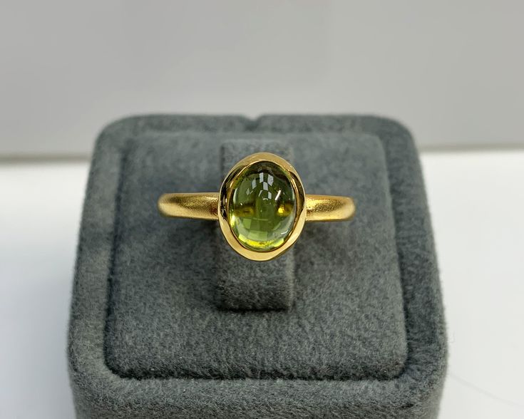 Natural Peridot Ring * Dainty Cabachon Ring * Genuine Peridot & 14K Solid Gold * Best Gift for Her/Him * Handmade Ring ◎ Details ◎ ○ Gemstone Details .Natural PERIDOT Oval Cut 9X7 mm approx. 2.01 ct ○ Gold Details 14K Solid Gold Width of Band : 2.50 mm Weight of Ring : approx 3.80 gr Made to Order HANDMADE ITEM ○ Upgrade to Solid 18K Gold, please click the link below: https://www.etsy.com/listing/962826004 For more CABACHON BEZEL rings : http://etsy.me/37fvI60 ○ PERIDOT RINGS : https://etsy. Yellow Gold Oval Cabochon Gemstones For Anniversary, Gold Sapphire Ring With Oval Cabochon Bezel Setting, Gold Oval Gemstones With Bezel Setting, Oval Cabochon Gold Birthstone Ring, Gold Cabochon Gemstones For Anniversary, Gold Cabochon Gemstones For Wedding, Gold Oval Cabochon Gemstones For Anniversary, Gold Oval Cabochon Gemstones For Fine Jewelry, Gold Oval Cabochon Birthstone Ring With Bezel Setting