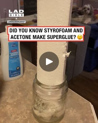 a glass jar filled with water sitting on top of a counter