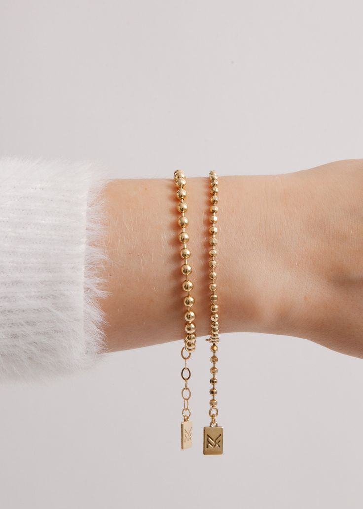 Like the popular lifestyle blogger Amy Jackson for which it was named, the Fashion Jackson bracelet emits an air of classy sophistication. Featuring an endless chain of luminous rounded gold beads, this piece has become everyone's must-have bracelet. Dress it up or down—the options are endless. STYLING TIP: Get Amy's look! Pair it with our best selling London Bracelet. 18k gold-plated sterling silver or sterling silver Adjustable from 6.5" to 8.25" and the beads are 4mm Modern Gold Ball Chain Jewelry, Minimalist Gold Bracelet With Ball Chain, Modern Gold Bracelets With Round Beads, Gold Bracelets With Round Beads And Extender, Modern Gold Bracelet With Round Beads, Elegant Gold Beaded Bracelets With Ball Chain, Everyday Gold Ball Chain Beaded Bracelets, Gold Adjustable Ball Chain Bracelet, Everyday Ball Chain Bracelet