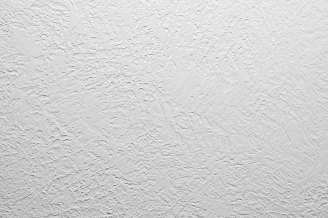 a white wall that has been painted with some kind of textured paint on it