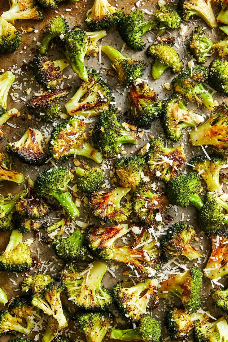 cooked broccoli florets with parmesan cheese sprinkled on top