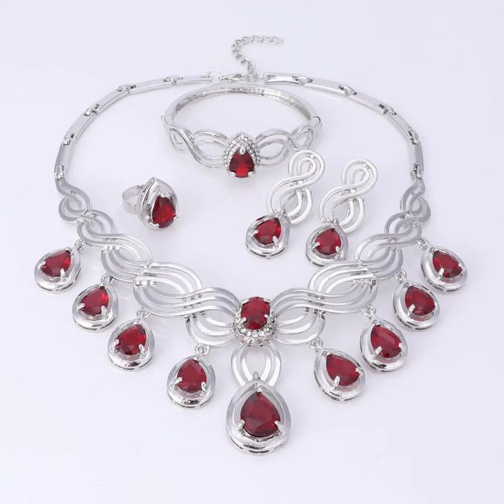 Elegant Crystal Statement Necklace Set Elegant Christmas Party Necklaces, Christmas Party Jewelry With Cubic Zirconia, Elegant Ruby Jewelry Sets For Party, Red Alloy Jewelry For Party, Elegant Christmas Formal Jewelry, Elegant Metal Jewelry Sets For Valentine's Day, Elegant Christmas Jewelry For Formal Occasions, Crystal Jewelry For Christmas Party, Ruby Jewelry Sets For Party