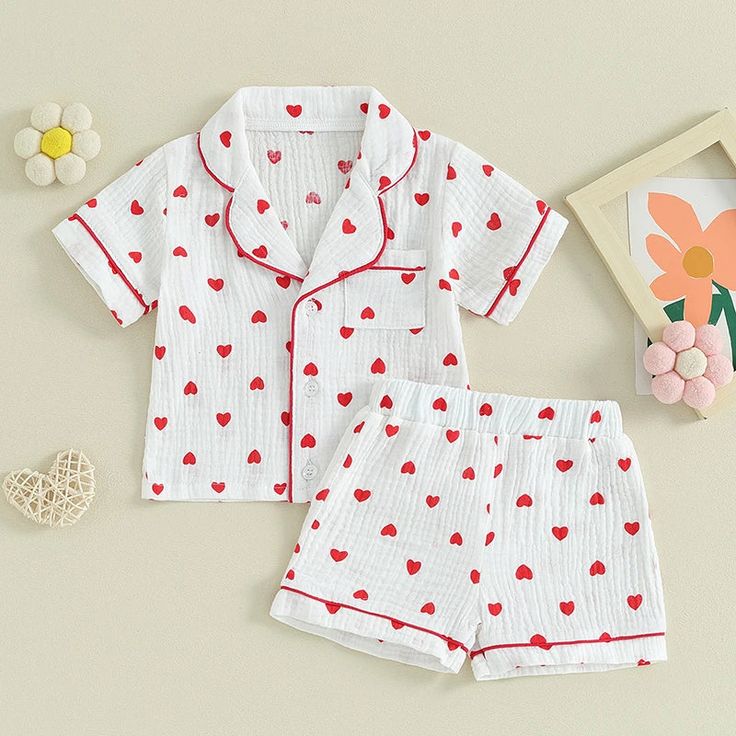 Fall in love with our HEARTS Muslin Pyjamas for baby girls! Featuring a playful hearts pattern, these pyjamas are perfect for Valentine's Day, or keeping cool and comfortable in the summer. Designed for your little sweetheart, these pyjamas are a must-have! Cute Printed Cotton Sleepwear, Cute Cotton Sleepwear With Cartoon Print, Cute Printed Sets For Pajama Party, Playful Printed Cotton Sleepwear, White Cotton Pajama Party Sets, Red Bedtime Sets For Spring, Spring Cartoon Print Sets For Bedtime, Spring Bedtime Sets With Cartoon Print, Cartoon Print Cotton Sleepwear For Summer