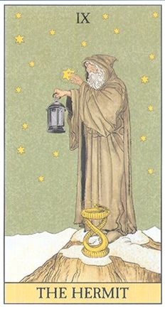 the hermit tarot card with an image of a man holding a lantern