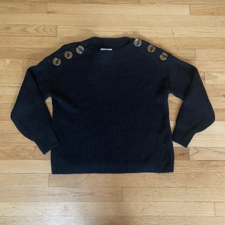 Black Sweater With Buttons On The Shoulders That Can Be Unbuttoned. Trendy Black Sweater With Button Closure, Trendy Black Sweater With Buttons, Black Crew Neck Sweater With Buttons, Black Buttoned Crew Neck Sweater, Orange Oversized Sweater, For The Republic, Sweater With Buttons, Heavy Knit Sweater, Chunky Turtleneck Sweater