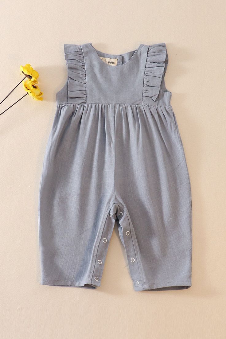 DESCRIPTION Unleash your little girl's playful side with our Gray Linen Ruffle Romper! Made from soft and breathable linen, this romper features charming ruffles that add a touch of whimsy. Perfect for warm weather days, this romper will keep your little one comfortable and stylish. Let her romp away! FABRIC CONTENTS Linen & Cotton PRODUCT CARE To launder this garment effectively while preserving its quality, follow these detailed washing and care instructions: Machine wash cold on gentle cycle. Wash similar colors together. Avoid using bleach products. Line dry in shade. Iron on a warm setting. Cotton Jumpsuits And Rompers With Ruffles, Spring Cotton Bubble Romper With Ruffle Sleeves, Cute Bubble Romper With Ruffled Straps For Summer, Cute Summer Bubble Romper With Ruffled Straps, Cotton Bubble Romper With Ruffle Sleeves For Summer, Summer Cotton Bubble Romper With Ruffle Sleeves, Solid Summer Bubble Romper With Ruffles, Summer Solid Color Bubble Romper With Ruffles, Summer Bubble Romper With Ruffles