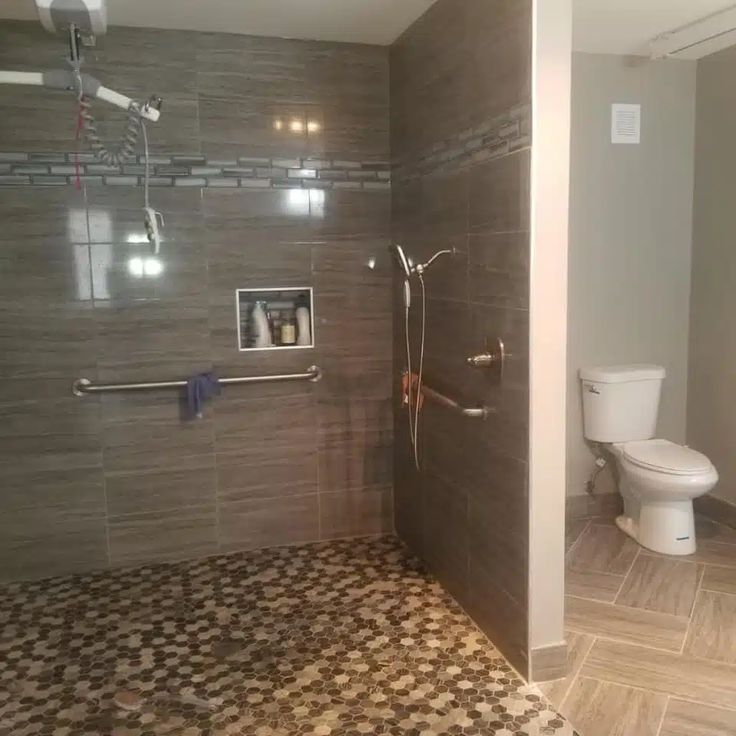 a bathroom with tiled floors and walls