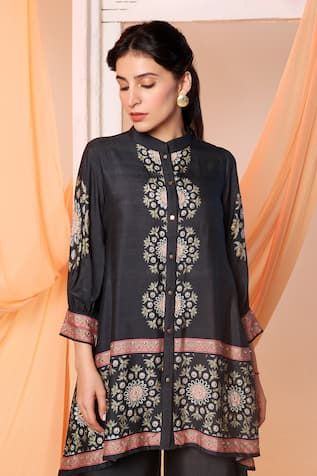 Black chanderi high low shirt style tunic with thread and sequin embellished circular motifs. Paired with coordinating flared pant. - Aza Fashions Chanderi Resham Embroidery Straight Kurta Top, Straight Kurta Top With Resham Embroidery In Chanderi, Designer Wear Blouse With Printed Motifs For Navratri, Navratri Designer Blouse With Printed Motifs, Eid Tunic With Mirror Work, Designer Long Sleeve Tunic With Dupatta, Anarkali Chanderi Tops For Eid, Eid Tunic With Zari Work, Embroidered Straight Kurta Top In Chanderi