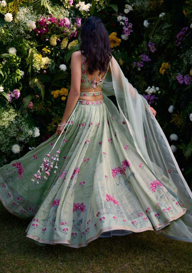 Embrace timeless allure in this smoke green block printed lehenga, elevated with exquisite zardozi embroidery. Paired gracefully with an organza dupatta, this ensemble exudes elegance and charm. Crafted with meticulous attention to detail, it's the perfect choice for those seeking to make a statement with their style at any special occasion. Printed Lehenga, Zardozi Embroidery, Organza Dupatta, Green Print, Lehenga, Block Print, Special Occasion, Embroidery, Green