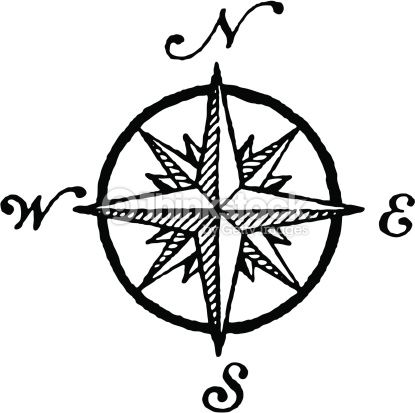 an image of a compass with the word s on it in brown and white ink