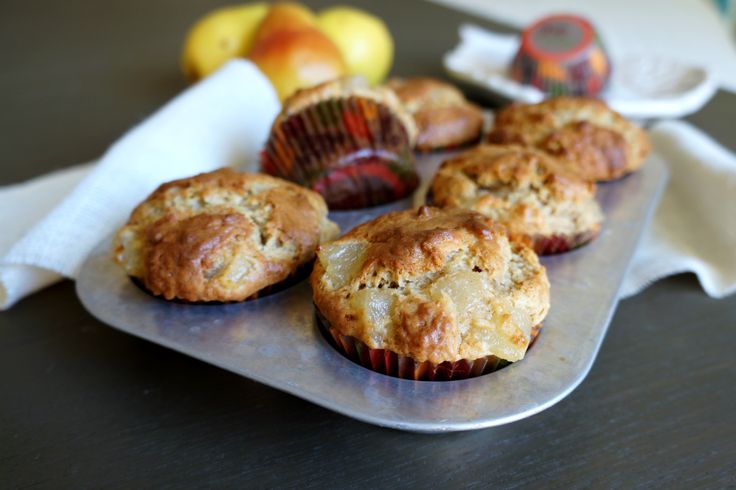 some muffins are sitting on a metal tray