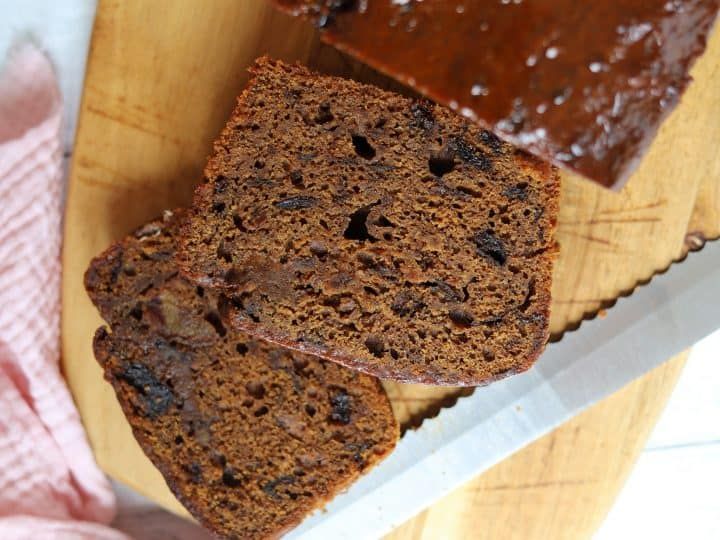 two slices of chocolate banana bread on a cutting board