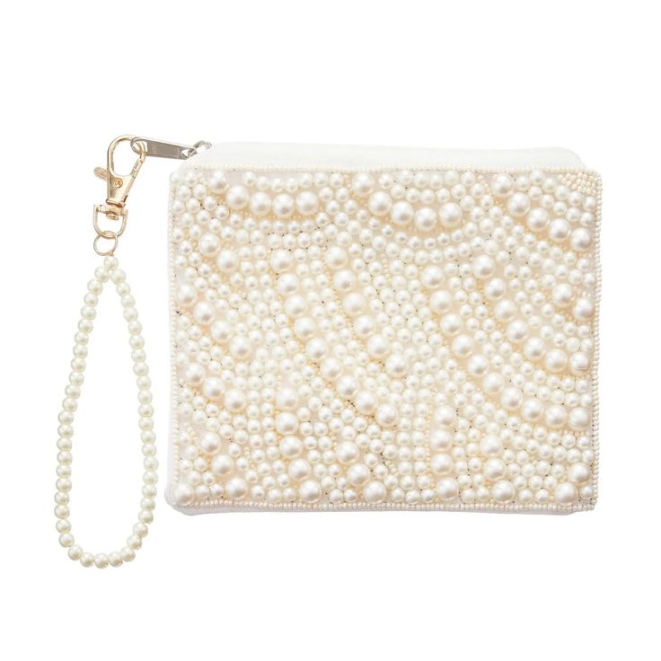 Indulge in luxury with our Pearl Beaded Wristlet Purse. This stylish and durable canvas coin pouch features a zipper closure to keep your coins and small accessories secure. Measuring approximately 5 1/2 inches in width and 4 1/2 inches in height, it's the perfect accessory for your daily needs! Perfect gift for our brides! Elegant Beige Coin Purse With Zipper Closure, Elegant Beige Coin Purse With Zipper, Coin Purse With Zipper Closure As Gift, Elegant Cream Clutch With Zipper Closure, Handheld Coin Purse With Zipper Closure As Gift, Cream Pouch Wristlet For Gift, Cream Pouch Wristlet Gift, Cream Pouch Wristlet As Gift, Elegant Handheld Wristlet With Zipper Pouch