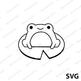 a frog sitting on top of a piece of paper with the word svg over it