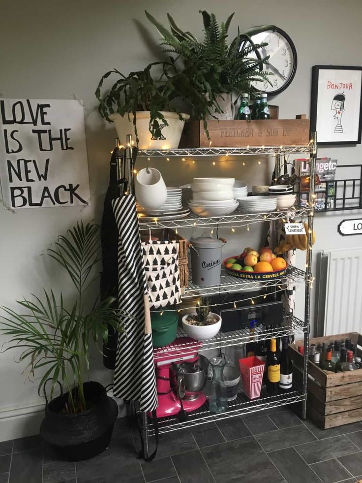 a shelf filled with lots of pots and pans