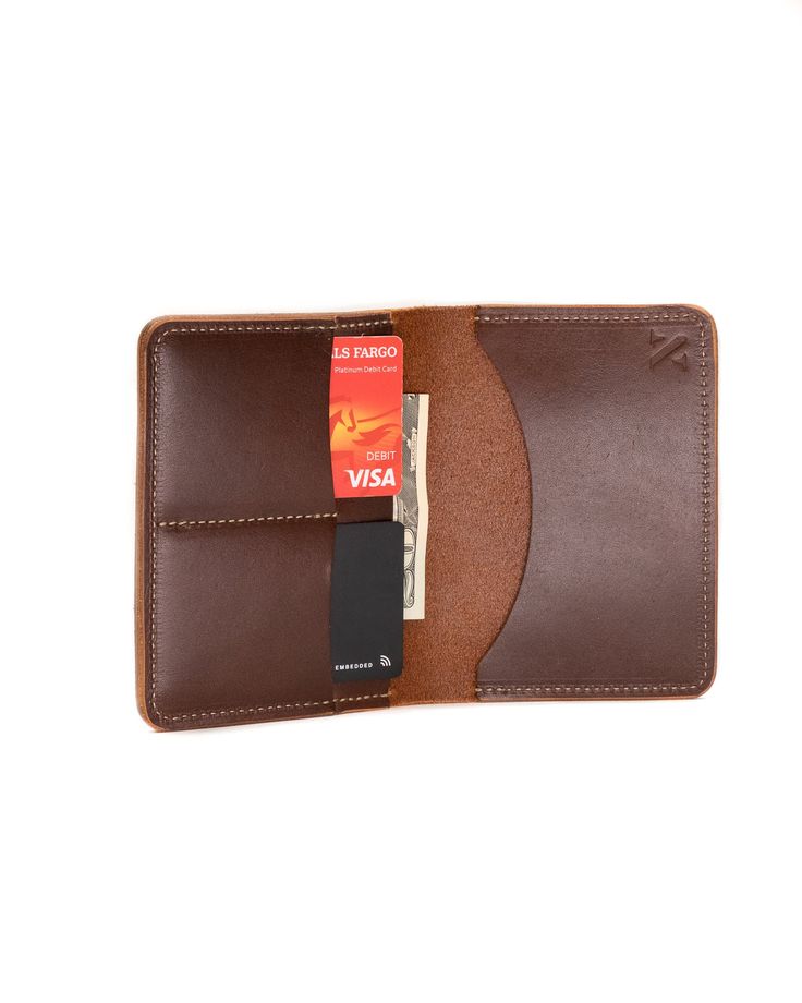 The Passport Wallet can hold all your essentials in one place. Not only is there a spot for your passport, you can fit credit cards, cash and plane tickets in there. Made with vegetable tanned leather. Travel Wallets With Smooth Grain In Brown, Leather Bifold Wallets With Cell Phone Pocket, Leather Bifold Wallet With Cell Phone Pocket, Brown Travel Wallet With Smooth Grain, Brown Smooth Grain Wallets For Travel, Brown Smooth Grain Wallet For Travel, Brown Smooth Grain Travel Wallet, Trifold Card Holder With Coin Pocket For Travel, Trifold Wallet With Interior Card Slots For Travel