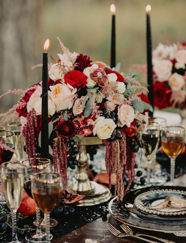 an elegant table setting with candles and flowers