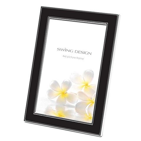 a black and white frame with yellow flowers on the bottom, in front of a white background