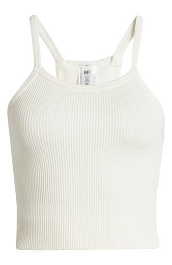 A seamless design makes for comfy layering in this cropped, casual-cool tank made from stretchy, textured fabric. Scoop neck Racerback 79% rayon, 17% nylon, 4% spandex Machine wash, line dry Imported Not available for sale and shipment to Germany Casual Seamless Tank Top For Spring, Casual Spring Tank Top With Seamless Design, Spring Seamless Cami Crop Top, Casual Cropped Seamless Tank Top, Summer Cropped Seamless Tank Top, Spring Seamless Crop Top, White Sleeveless Seamless Crop Top, Casual Cropped Top With Seamless Design, Trendy White Seamless Crop Top