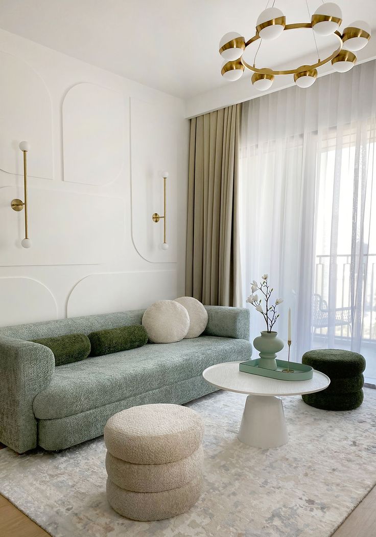 a living room filled with furniture and a chandelier