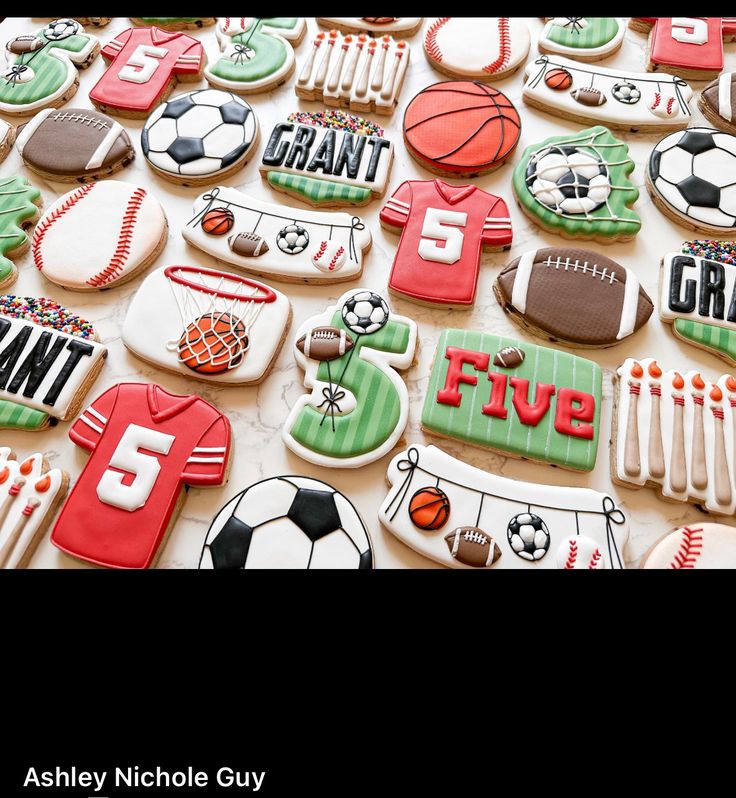 cookies decorated with different sports related items