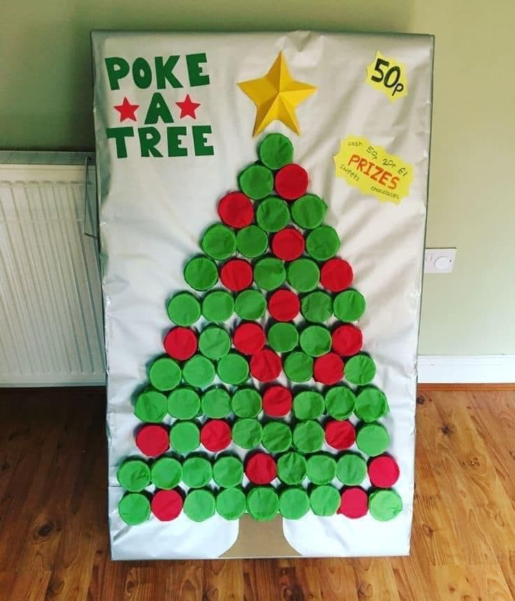 a christmas tree made out of cupcakes is displayed on a white board with red and green buttons