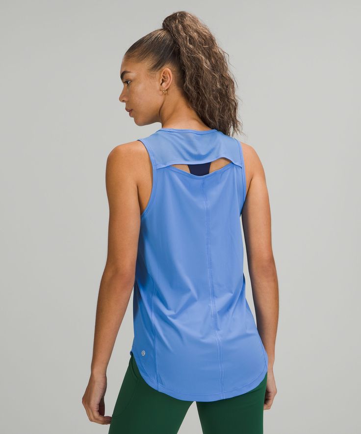 Sprints anyone This lightweight tank has mesh fabric panels for breathability in sweaty situations. Designed for On the Move. An easy fit that floats away from your body:Sits below the waistband for moderate, everyday coverage. Reflective details help keep you on the radar. 'Wash with like colours', 'Machine wash cold', 'Do not bleach', 'Tumble dry low', 'Do not iron', 'Do not dry clean', 'Imported'. Sweat-Wicking Fabric. Body: 73% Nylon, 27% Xtra life lycra elastane. Contrast: 89% Nylon, 11% El Miss Us, Lightweight Tops, Bra Straps, Fabric Panels, Personal Shopping, Sleeveless Tank Top, Sleeveless Tank, Hip Length, Mesh Fabric