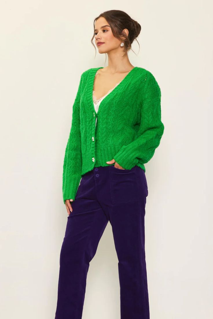 Introducing our Green Cable-Knit Cardigan with Jewel-Embellished Buttons – a luxurious and stylish addition to your fall wardrobe. This cardigan offers a soft texture and elegant details that effortlessly elevate your outfits while keeping you warm and cozy. Embellished Buttons, Maxi Jumpsuit, Swimwear Sets, Cable Knit Cardigan, Button Cardigan, Long Sleeve Midi, Skirt Leggings, Fall Sweaters, Soft Texture