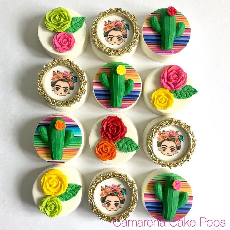 there are many decorated cupcakes with flowers on the top one is made to look like cactuses