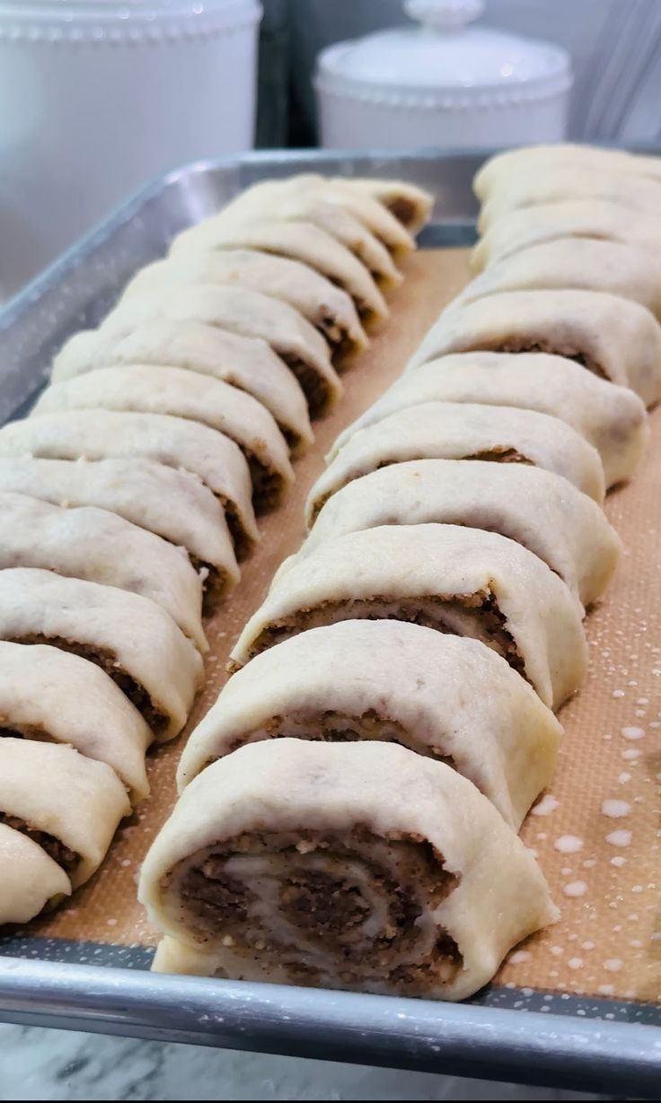 some food is sitting on a tray ready to be cooked and put in the oven