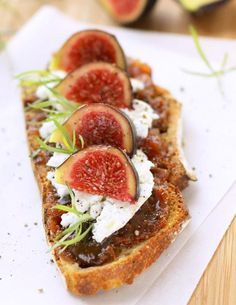 toasted bread with figs and goat cheese on it