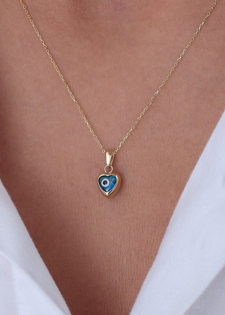 Ready to Ship 1-3 Business Days  Evil Eye Blue Necklace in 14k Solid Gold * Heart Evil Eye Pendant-Blue Heart Necklace Handmade item Materials: Gold, Rose gold, White gold Made to Order Pendant height: 7 mm/0.28 ınches Pendant width: 7 mm/0.28 ınches Pendant thickness:4.5 mm /0.18 ınches P R O D U C T ∙ F E A T U R E S * Gold material: 14k solid gold * Gold color options: Yellow gold, Rose gold, White gold * Choice of chain length: 14, 16, 18, 20, Pendant Only  We carefully produce our 14k real Blue Dainty Jewelry For Valentine's Day, Blue Tarnish-resistant Jewelry For Anniversary, Blue Heart Charm Necklaces, Blue Heart Pendant Necklace As Gift For Her, Gold Heart Beads Jewelry For Birthday, Blue Dainty Necklace With Heart Charm, Blue 14k Gold Necklaces For Anniversary, Blue 14k Gold Heart Pendant Jewelry, Dainty Blue Necklace With Heart Charm