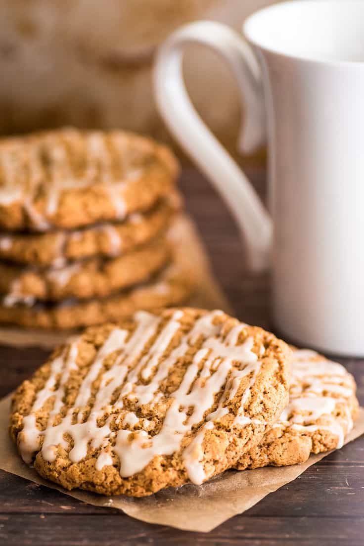 cookies with icing and coffee on a wooden table