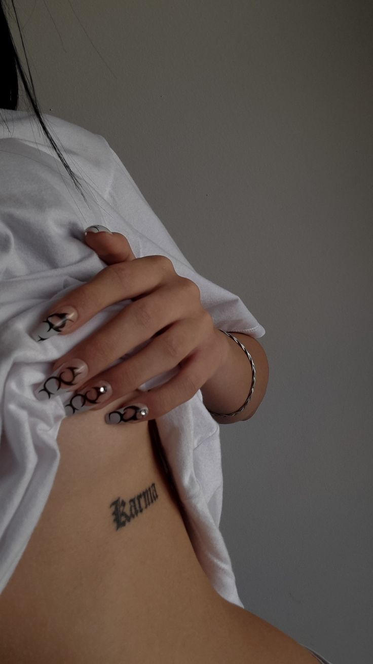 a woman with tattoos on her stomach