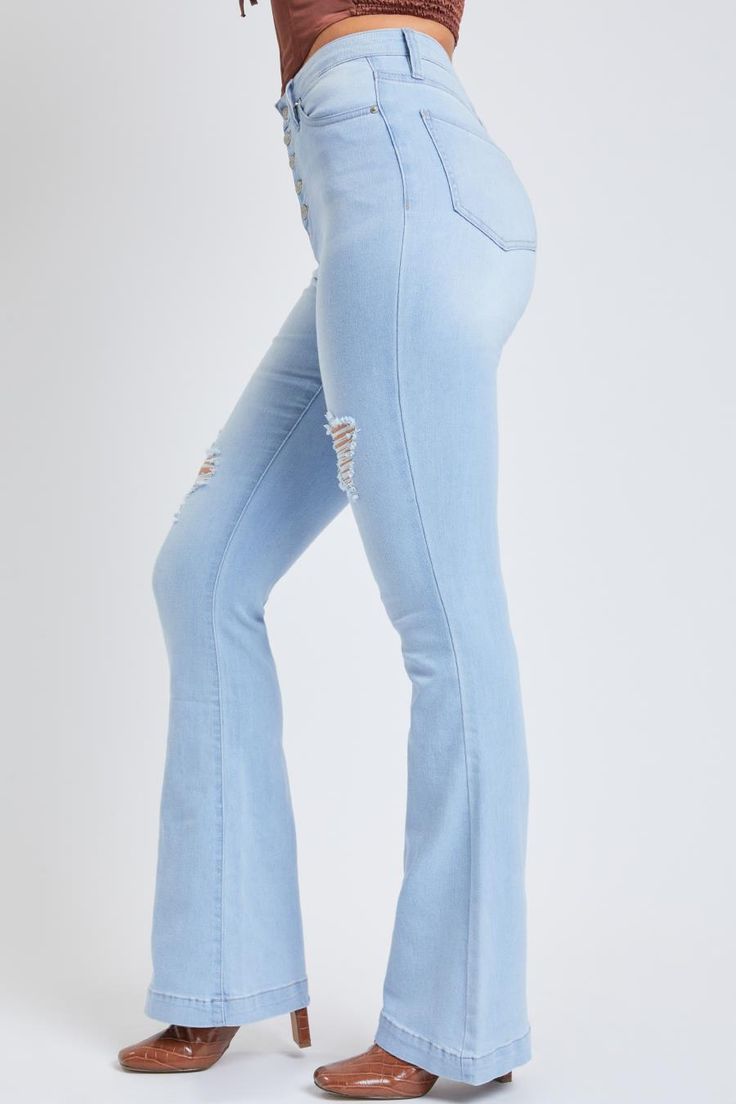 A 70’s flare with a modern twist! Our Women's Flare With Exposed Buttons Made With Recycled Fiber is the perfect 70's inspired jean with some added edge! Designed with an exposed button fly and some light distressing for an ultra-trendy look! Not only will you look amazing in these, but you’ll feel amazing too! These flares are made with super stretchy denim that moves with you. Oh, and did we mention they’re sustainably made too? Yep, these jeans are made with recycled fibers, which seems hard Trendy Distressed Flares For Spring, Fitted Distressed Flares For Spring, Distressed Fitted Flares For Spring, Spring Ripped Flare Jeans, Spring Season Mid-rise Distressed Flares, Spring Denim Flares With Distressed Details, Spring Distressed Denim Flares, Distressed Straight Leg Flares For Spring, Spring Retro Denim Flares