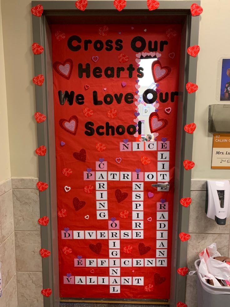 a door decorated with hearts and the words cross our hearts, we love our school