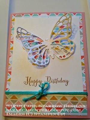 a birthday card with a butterfly on the front, and a ribbon at the bottom