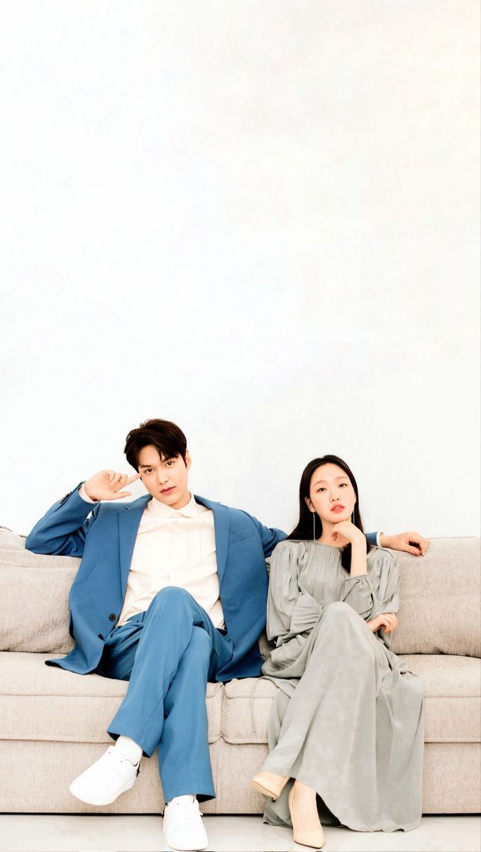 a man and woman sitting on a couch