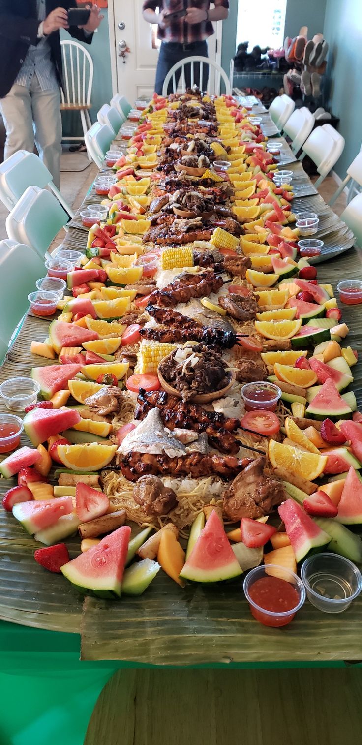 a long table filled with lots of different types of food