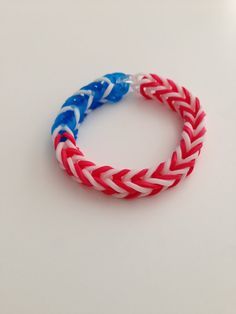 a red, white and blue bracelet on a table