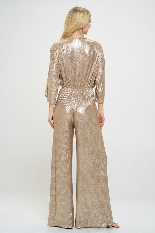 Kimono Sleeve Wide Leg Jumpsuit. Metallic Fabric.Fabric Content: 95% Polyester, 5% Spandex.Made in USA Style: casual, formal Print / Pattern: solid, gold Silhouette: wideleg jumpsuit Fit: regular Neck Line: v neck Sleeve: shortsleeve Lining: no Made In: Made in U.S.A Gold Jumpsuits And Rompers For Summer Party, Gold Jumpsuit And Romper For Summer Party, Gold Jumpsuits And Rompers For Evening Party Season, Glamorous Gold Jumpsuits And Rompers For Party Season, Gold Jumpsuit For Evening Party Season, Gold Stretch Jumpsuits And Rompers For Party, Elegant Gold Jumpsuits And Rompers For Party, Gold Stretch Jumpsuit For Night Out, Formal Full-length Jumpsuits And Rompers For Spring